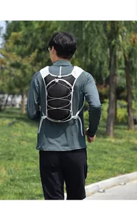 Close-up detail view of the outdoor running hydration vest backpack worn by a model