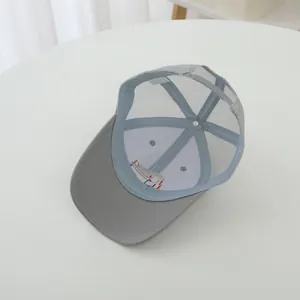 Inside view of breathable grey mesh baseball cap for kids with fire truck detail.