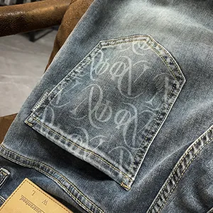 Vintage washed distressed slim fit men's denim pants with printed pocket detail