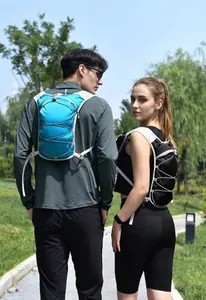 Detail view of the outdoor running vest backpack shown on models in a lush park