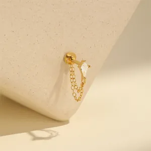Detailed view of 16G gold plated silver cartilage stud with marquise CZ and double chain