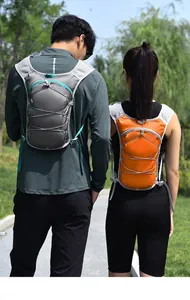 Outdoor cycling and running vest-style hydration backpack shown in grey and orange colors