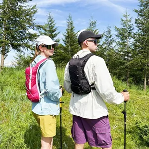 Lightweight waterproof cycling and hiking backpack shown in a scenic outdoor forest setting.