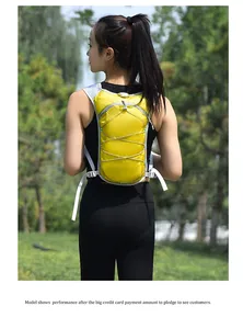 Lightweight yellow outdoor running vest backpack shown on model in nature setting.