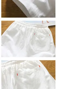 Detail of breathable white cotton linen shorts with back pocket and red accents