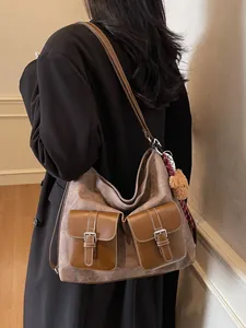 Fashionable women's denim pattern shoulder bag with brown buckle pockets and bear charm