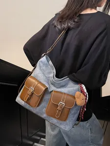Fashionable denim texture hobo bag with dual front buckle pockets and bear charm accessory