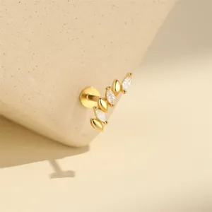 Close-up of a 16G gold-plated silver labret stud with marquise-cut crystals