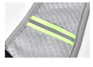 Close-up view of the reflective safety strip on breathable mesh for running vest