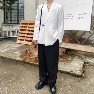 Minimalist men's white casual blazer and black wide-leg trousers streetwear set