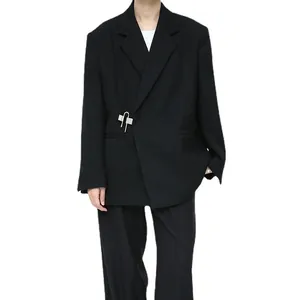Minimalist black oversized blazer for men with unique silver pin closure detail