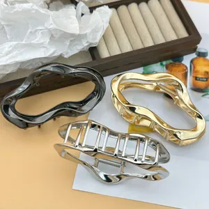 Elegant irregular cloud-shaped metal hair claw clips available in gold, silver, and black finish.