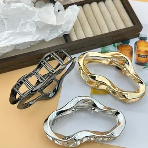 Set of large irregular wave metal hair claw clips in gold silver and gunmetal finishes