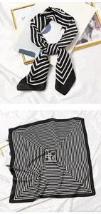 Detailed view of a vintage black and white striped silk square scarf and head tie