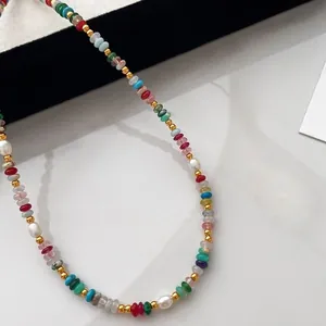 Close-up of rainbow beaded necklace with freshwater pearls and natural stones