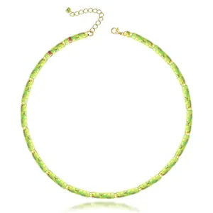 Detail view of green natural stone spacer bead necklace with gold clasp