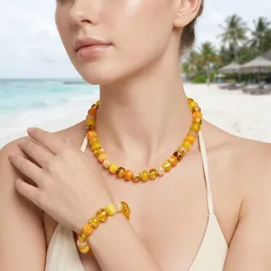 Summer vacation style dopamine beaded necklace and bracelet set with high gloss amber resin.