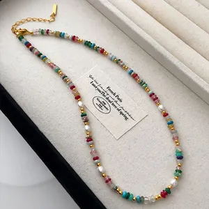 Detailed shot of a colorful natural stone necklace featuring mini freshwater pearls