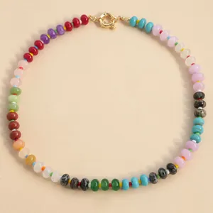 Detailed view of multi-colored natural stone beads on a candy-colored choker necklace