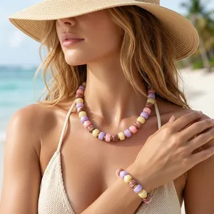 Close-up detail of model wearing colorful summer Dopamine style resin beaded necklace and bracelet