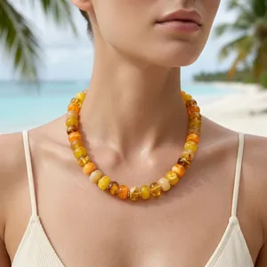 Close-up detail of summer dopamine beaded necklace with glossy amber resin beads