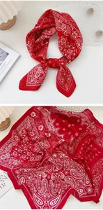 Detailed macro view showing the texture of a red retro paisley square silk scarf