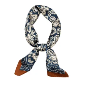 Vintage paisley silk scarf with navy blue and brown accents for versatile styling.