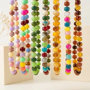 Close-up detail of colorful dopamine resin beaded necklaces with marble textures