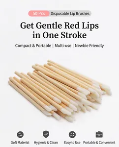 Detailed macro view of 50 disposable bamboo handle lip brushes with soft white tips