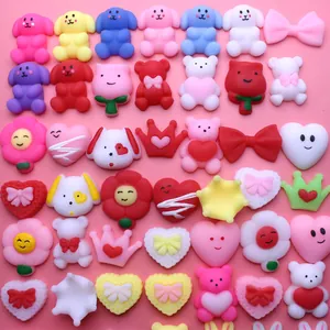 Variety of colorful TPR squishy stress relief toys with cute animal shapes on pink base