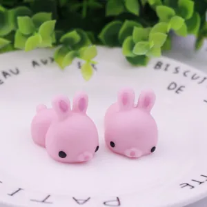 Close-up detail of two pink rabbit-shaped squishy toys for stress relief and play