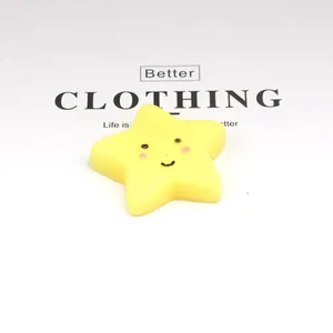 Close-up of a yellow star-shaped TPR squishy toy with a cute smiley face design