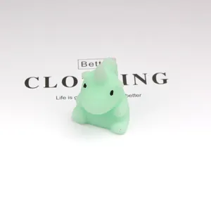 Close-up of a mint green rhinoceros squishy toy on a clean white background
