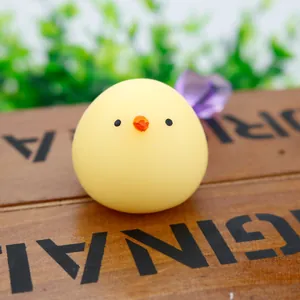 Detailed macro view of a cute yellow chick squishy toy for stress relief on wood