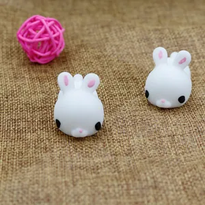 Close-up view of two cute white rabbit squishy toys made of soft and elastic TPR material