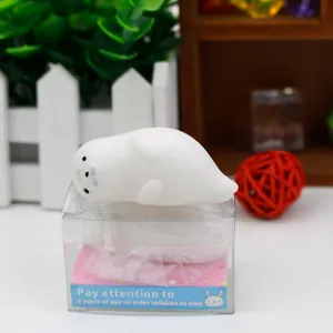 Close-up detail of a white seal animal squishy stress relief toy on its packaging box.