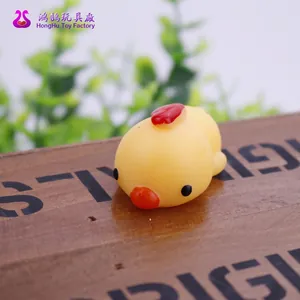 Close-up macro shot of a cute yellow chicken TPR squishy stress relief toy for kids