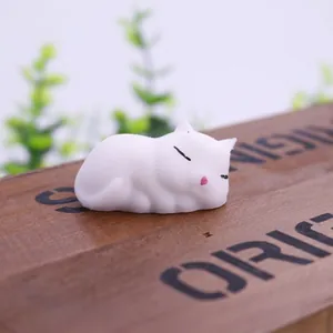 Detailed close-up of a cute white sleeping cat squishy toy made of soft and elastic TPR material