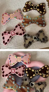 Detailed view of Y2K bowknot hair clips with unique embroidered thread edges