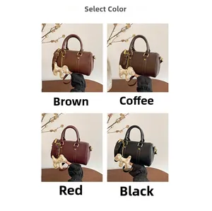 Detail showing color variants of a stylish Boston pillow bag with a monogrammed dog charm