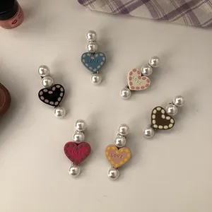 Set of 6 colorful heart-shaped hair clips with elegant pearls and LOVE engraving.