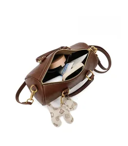 Interior of brown Boston handbag showing ample storage space and organized compartments