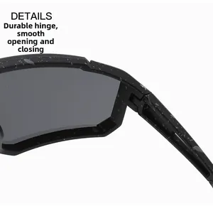 Close-up detail of sturdy hinge on kids sports cycling sunglasses with paint splatter