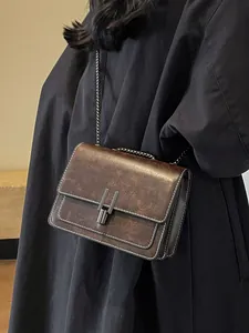 Vintage brown faux leather crossbody bag with elegant chain strap for women.