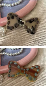 Close-up of Y2K leopard print bow hair clips with hand-stitched detail