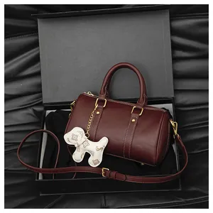 Premium burgundy Boston pillow bag for women with cute puppy charm in a black gift box