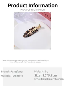 Close-up of a leopard print acetate hair clip detailing material and size dimensions