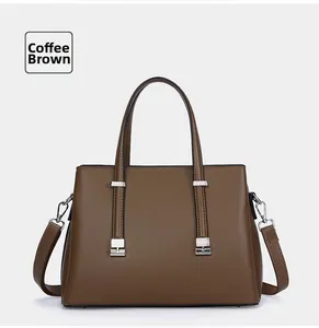 Elegant coffee brown leather tote bag with structured handles and silver-tone hardware.