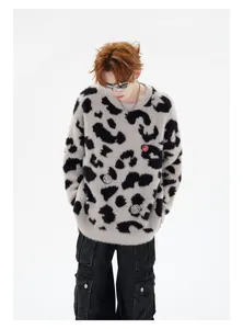 Streetwear look featuring a vintage leopard print mohair sweater with metal badge details