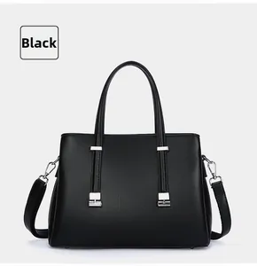 Elegant black large capacity commuter leather tote bag with silver hardware for women